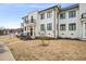 Beautiful townhome with manicured lawn, stylish exterior, and balcony at 605 Smedes Pl # A, Raleigh, NC 27605