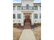 Inviting front entrance with a brick staircase leading to a wood door at 605 Smedes Pl # A, Raleigh, NC 27605