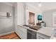 Stylish kitchen with sleek countertops, stainless steel dishwasher and sink, and modern appliances in a well-lit space at 605 Smedes Pl # A, Raleigh, NC 27605
