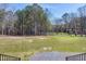 Image of a large green backyard surrounded by tall, mature trees at 6480 Beaver Creek Rd, New Hill, NC 27562