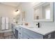 Elegant bathroom with double vanity, decorative mirrors, and a beautifully tiled shower at 6480 Beaver Creek Rd, New Hill, NC 27562