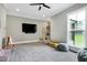Large bonus room features carpet, neutral walls, natural light and ample open space for furniture at 6480 Beaver Creek Rd, New Hill, NC 27562