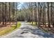 Gated driveway leading up to the house at 6480 Beaver Creek Rd, New Hill, NC 27562