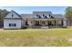 Beautiful farmhouse-style home with a welcoming front porch and well-maintained lawn at 6480 Beaver Creek Rd, New Hill, NC 27562