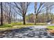 Beautiful lot with mature trees and grass surrounding the home at 6480 Beaver Creek Rd, New Hill, NC 27562