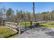 Gated fence enclosing the property, ensuring privacy and security for the farmhouse at 6480 Beaver Creek Rd, New Hill, NC 27562