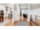 Open-concept foyer leading to the kitchen and living room with hardwood floors at 6480 Beaver Creek Rd, New Hill, NC 27562