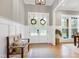 Bright entryway featuring double doors, wood accents, and a decorative bench at 6480 Beaver Creek Rd, New Hill, NC 27562