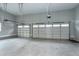 Spacious garage with two overhead doors and openers, offering convenient parking and storage solutions at 6480 Beaver Creek Rd, New Hill, NC 27562