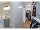 Hallway with access to the main bathroom, which connects to a luxury walk-in closet at 6480 Beaver Creek Rd, New Hill, NC 27562