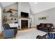 Inviting living room with a fireplace, built-in shelves, and comfortable seating at 6480 Beaver Creek Rd, New Hill, NC 27562