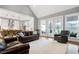 Spacious living area with hardwood floors, bright windows, and an open concept design at 6480 Beaver Creek Rd, New Hill, NC 27562