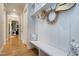 Hallway showing mudroom with bench seating, storage, and coat hooks, providing a convenient transition space at 6480 Beaver Creek Rd, New Hill, NC 27562