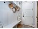 Mudroom with built-in bench, storage, and coat hooks, offering a practical and stylish entryway solution at 6480 Beaver Creek Rd, New Hill, NC 27562