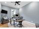 This home office is complete with modern desk, chair, printer, and exterior views at 6480 Beaver Creek Rd, New Hill, NC 27562