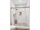 Beautiful tiled shower featuring black hardware, a shower niche, and natural light at 6480 Beaver Creek Rd, New Hill, NC 27562