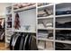 A luxurious closet with shelving, rods for hanging clothes, and organizers for shoes and purses at 6480 Beaver Creek Rd, New Hill, NC 27562