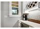 Convenient wet bar featuring a wine rack, a beverage cooler, and extra counter space at 6480 Beaver Creek Rd, New Hill, NC 27562
