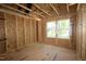 Unfinished bedroom space featuring two bright windows with natural light, ready for customization at 6960 Doddridge Ln # 15, Cary, NC 27519