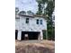 Two-story home under construction with Tyvek wrap and windows installed at 6960 Doddridge Ln # 15, Cary, NC 27519