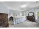 Inviting bedroom with soft blue walls, plush carpet, and elegant furnishings at 721 Blenheim Dr, Raleigh, NC 27612