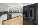 Kitchen with granite countertops, stainless appliances, white cabinets and view to dining area at 721 Blenheim Dr, Raleigh, NC 27612