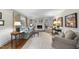 Inviting living room features a cozy fireplace, built-in bookshelves and beautiful hardwood floors at 721 Blenheim Dr, Raleigh, NC 27612
