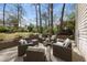 Outdoor patio with comfortable seating, fire pit, and a beautiful backyard setting at 721 Blenheim Dr, Raleigh, NC 27612