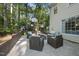 Inviting outdoor patio with stylish seating, lush greenery, and a serene atmosphere for relaxation and socializing at 721 Blenheim Dr, Raleigh, NC 27612