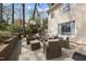 Back patio with stylish wicker furniture, a cozy ambiance, and serene backyard views at 721 Blenheim Dr, Raleigh, NC 27612