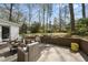 Backyard patio with relaxed seating area, beautiful plants, and views of the lush yard at 721 Blenheim Dr, Raleigh, NC 27612