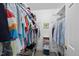 Organized walk-in closet featuring ample shelving and hanging space for clothes and accessories at 721 Blenheim Dr, Raleigh, NC 27612