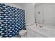 Bathroom with a whale-themed shower curtain, white sink, and vanity at 7628 Winners Edge St, Raleigh, NC 27617