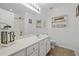Bright bathroom with a large mirror, white vanity, and shower at 7628 Winners Edge St, Raleigh, NC 27617