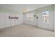 Large bedroom with white walls, neutral carpet, and a pendant light at 7628 Winners Edge St, Raleigh, NC 27617
