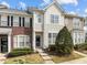 Charming townhouse with mixed brick and siding, complemented by landscaped bushes at 7628 Winners Edge St, Raleigh, NC 27617