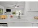 Kitchen with a large sink, white countertops, and stainless steel faucet at 7628 Winners Edge St, Raleigh, NC 27617