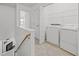 Upstairs laundry room with a washer and dryer at 7628 Winners Edge St, Raleigh, NC 27617
