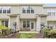 Rear patio surrounded by the home's exterior, air conditioning units, and landscaping at 7628 Winners Edge St, Raleigh, NC 27617