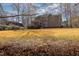 Expansive backyard with mature trees and lush lawn, perfect for outdoor activities at 765 Carlton St, Clayton, NC 27520