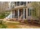 Charming front exterior view of the home, featuring a two-car garage and well-maintained landscaping at 765 Carlton St, Clayton, NC 27520