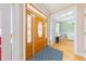 Inviting foyer with a beautiful front door and a view into the office at 765 Carlton St, Clayton, NC 27520