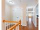 Upstairs hallway featuring hardwood floors, white trim, and neutral walls at 765 Carlton St, Clayton, NC 27520