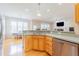 Open kitchen with stainless steel appliances, double sink and view into breakfast area at 765 Carlton St, Clayton, NC 27520