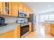 Well-equipped kitchen with stainless steel appliances and light wood cabinets at 765 Carlton St, Clayton, NC 27520