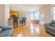 Bright and open living area with a kitchen view, breakfast area and hardwood floors at 765 Carlton St, Clayton, NC 27520