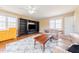 Spacious living room with hardwood floors, built-in bookshelves, and neutral paint at 765 Carlton St, Clayton, NC 27520
