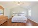 Spacious main bedroom with a vaulted ceiling, hardwood floors, and large window at 765 Carlton St, Clayton, NC 27520