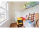 Well-lit storage area with window, shelving, and ample space for organization at 765 Carlton St, Clayton, NC 27520