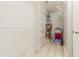 Bright walk-in closet featuring metal shelving and neutral-toned flooring, ready for organization at 765 Carlton St, Clayton, NC 27520